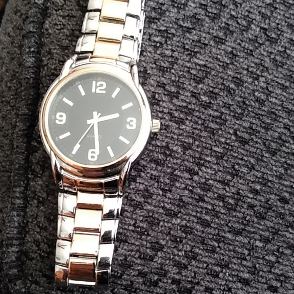 A quartz gold and silver watch